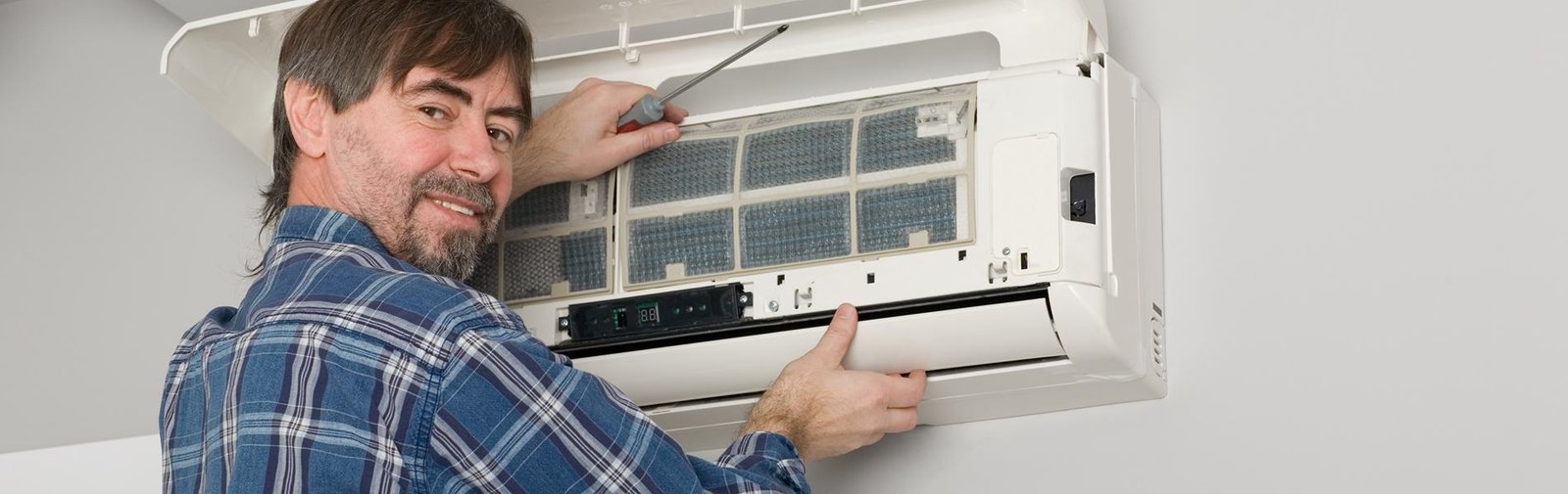 Best Aircond Care technician servicing an air conditioning unit